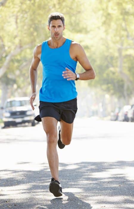 Male Runner Exercising On Suburban Street